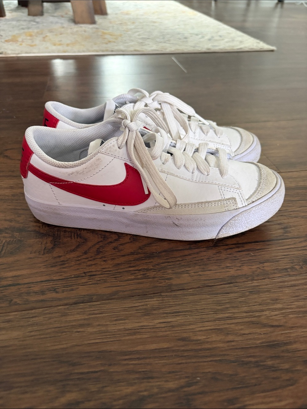 Nike Kids White Sneakers with Red Swoosh Accent